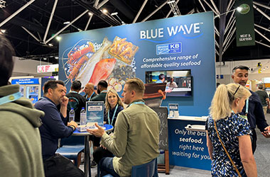 Blue Wave team speaking with foodservice professionals at Fine Food Sydney